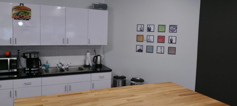 View of the finished kitchen area and people wall in the Schaefer Phoenix office.