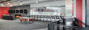 View of the upstairs player lounge area with window overlooking recreation room at the renovated Woody Hayes Athletic Center at The Ohio State University.